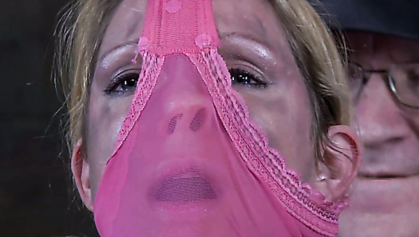 Mesmerizing blond hottie gets her legs locked in fetters and her face covered with her panties