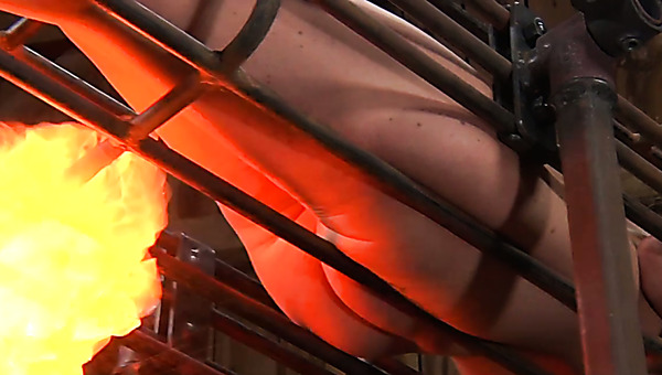 Svelte brunette cutie gets her naked ass burned with fire