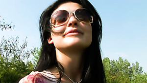 Dark haired sexy bitch in sunglasses pisses on the road side