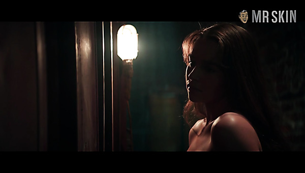 Romantic and sexy Emilia Clarke flashes her nice titties in one of the movies