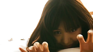 Luscious Japanese cutie slugs in bed flirting with cam