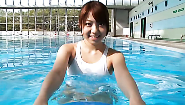 Chunky Japanese teen swims in a pool in white bikini