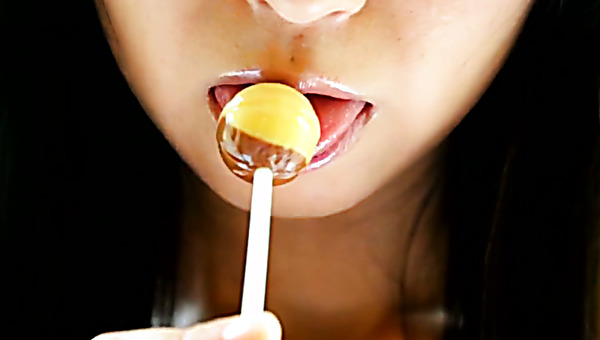 Depraved Asian hottie Yumi Ishikawa licks two lollipops