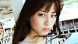 Desirable Asian girl Yumi Sugimoto puts makeup on her face