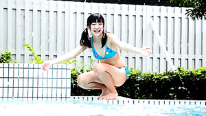 Adorable Asian girl with slim body Mizuki Moe swims in the pool