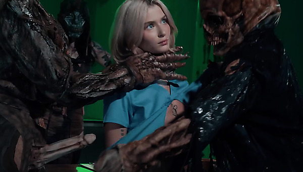 Skinny mortician gets fucked by a couple of demons