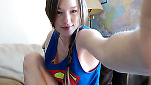 Sweet girl in Super man t-shirt Gemma Minx paints her toes