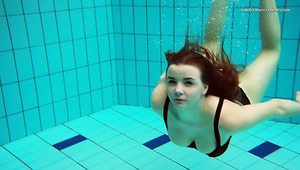 Beautiful Vesta stripping underwater in arousing solo video