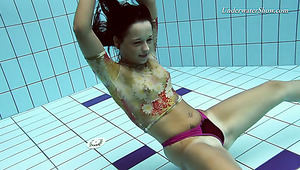 Beautiful teen Krasula Fedorchuk swimming naked in a pool