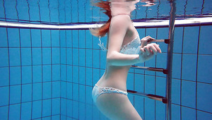 Incredible underwater striptease show performed by redhead Diana Zelenkina