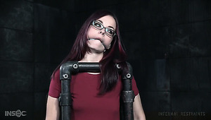 Nerdy redhead Ivy Addams takes a chance in BDSM workout