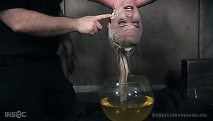 Pale short haired auburn slut Dresden is tied up and put into fish globe